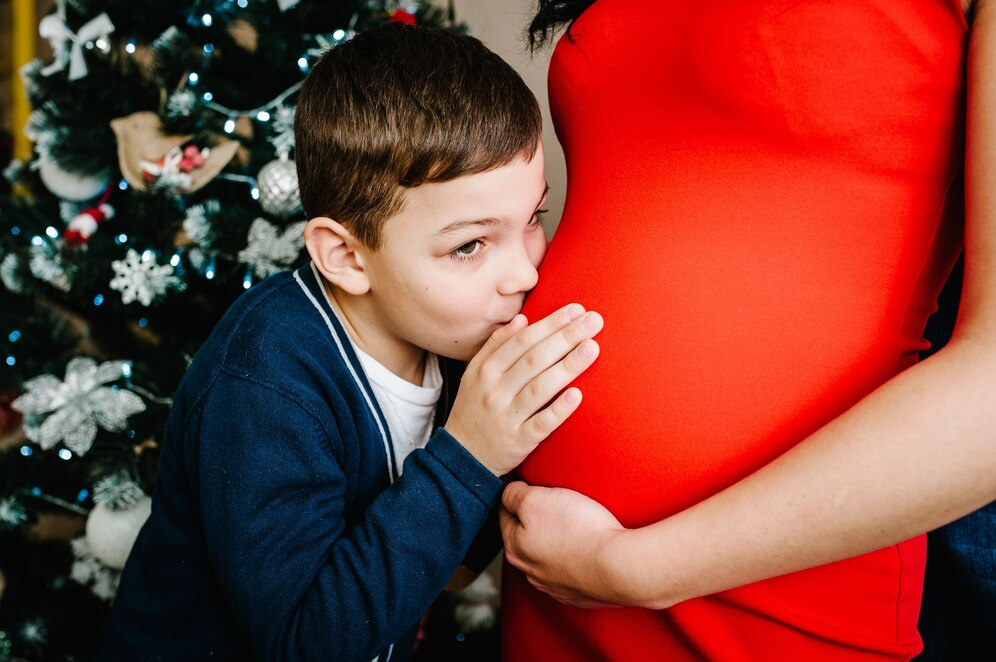 Sibling Kiss on the Bump